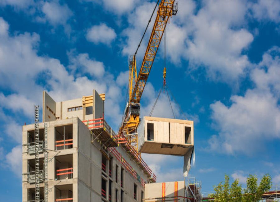 Construction site of an office building in Berlin. The new structure will be built in modular timber construction. MODULAR WOODEN HOUSES made out of renewable resources.